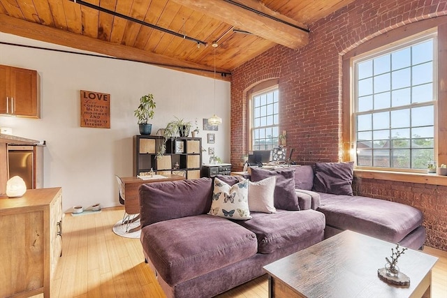 1511 Main St Unit C406, Worcester, MA 01603 - living room with plenty of natural light, a wood ceiling with exposed beams, brick wall, and light wood finished floors