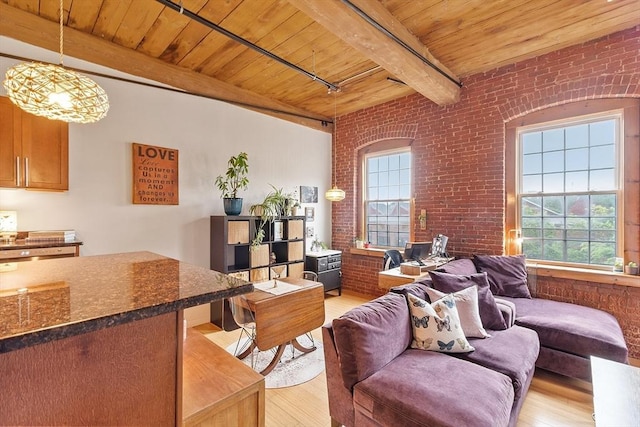 1511 Main St Unit C406, Worcester, MA 01603 - living room featuring brick wall, a wooden ceiling with exposed beams, and light wood finished floors
