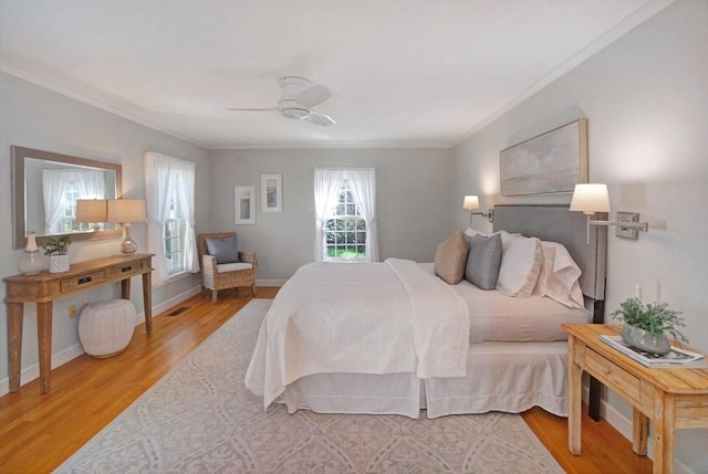 15 Edmonds Rd Unit 15, Concord, MA 01742 - bedroom featuring crown molding, wood finished floors, a ceiling fan, and baseboards