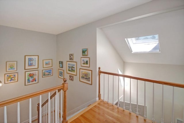 15 Edmonds Rd Unit 15, Concord, MA 01742 - hall with an upstairs landing, a skylight, wood finished floors, and baseboards