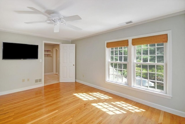 15 Edmonds Rd Unit 15, Concord, MA 01742 - empty room with plenty of natural light, crown molding, baseboards, and light wood-style flooring