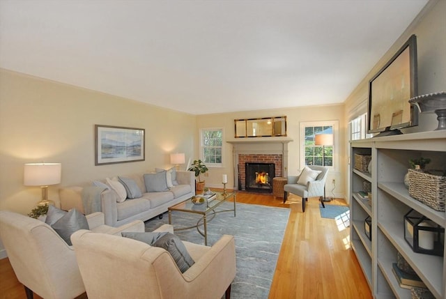 15 Edmonds Rd Unit 15, Concord, MA 01742 - living area with light wood finished floors, plenty of natural light, a brick fireplace, and baseboards