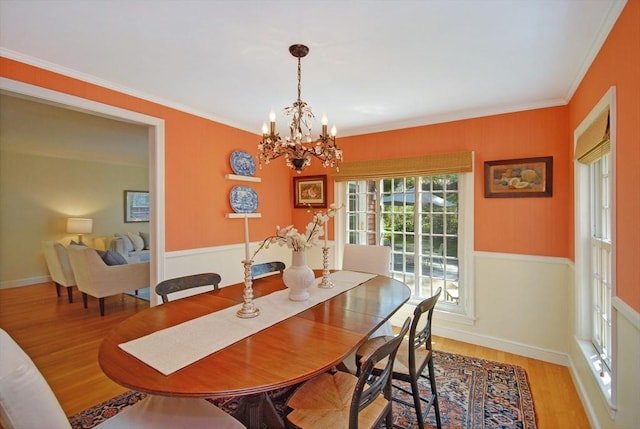 15 Edmonds Rd Unit 15, Concord, MA 01742 - dining space with wood finished floors, a chandelier, ornamental molding, and baseboards