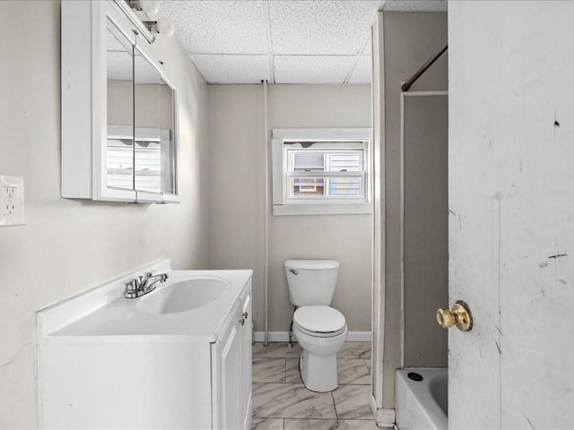 full bathroom with vanity, toilet, tub / shower combination, and a paneled ceiling