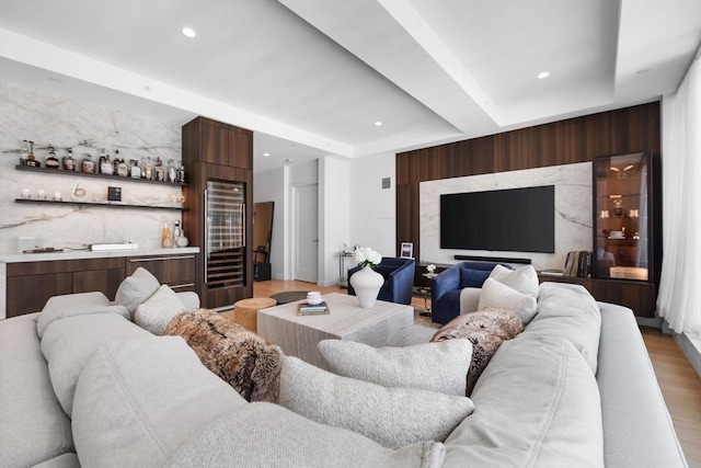 living room with visible vents, light wood-type flooring, wine cooler, indoor bar, and recessed lighting