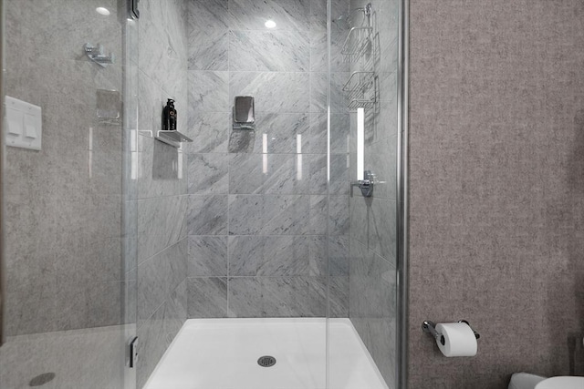 full bathroom with a shower stall