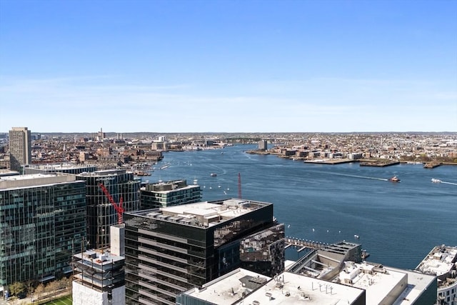 birds eye view of property with a city view and a water view