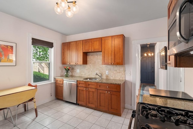 574 Ashmont St Unit 1, Boston, MA 02122 - kitchen featuring dishwasher, a chandelier, a sink, and brown cabinets