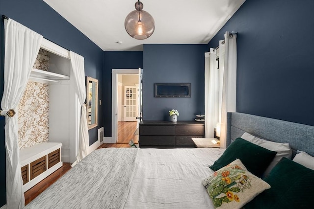 574 Ashmont St Unit 1, Boston, MA 02122 - bedroom with wood finished floors and baseboards