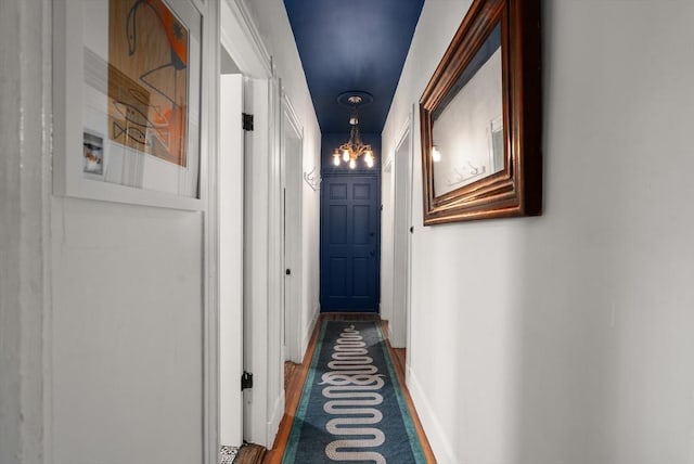 574 Ashmont St Unit 1, Boston, MA 02122 - corridor featuring a chandelier and baseboards