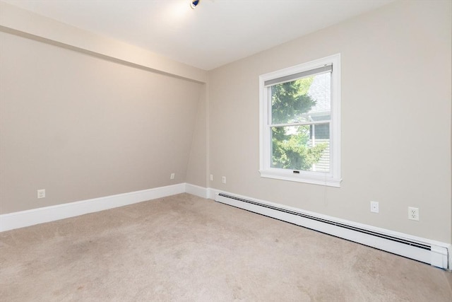 carpeted empty room with baseboards and a baseboard heating unit