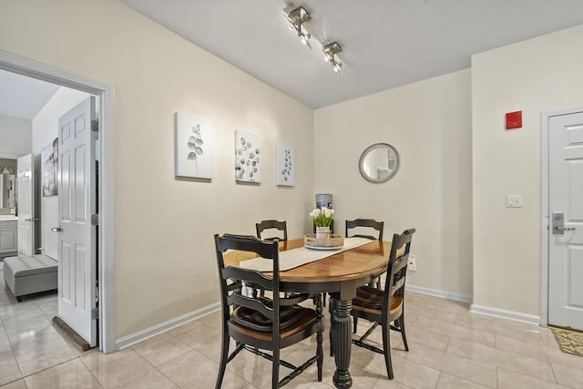 dining area featuring light tile patterned floors