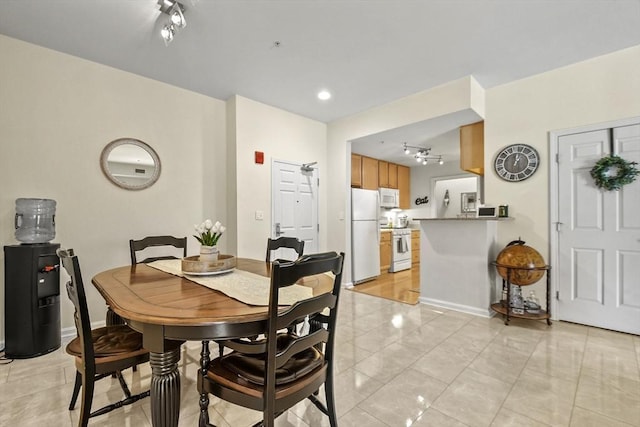 38 Village Rd Unit 309, Middleton, MA 01949 - dining space with rail lighting and baseboards