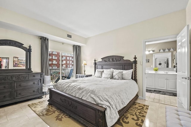 38 Village Rd Unit 309, Middleton, MA 01949 - bedroom featuring light tile patterned floors and ensuite bathroom