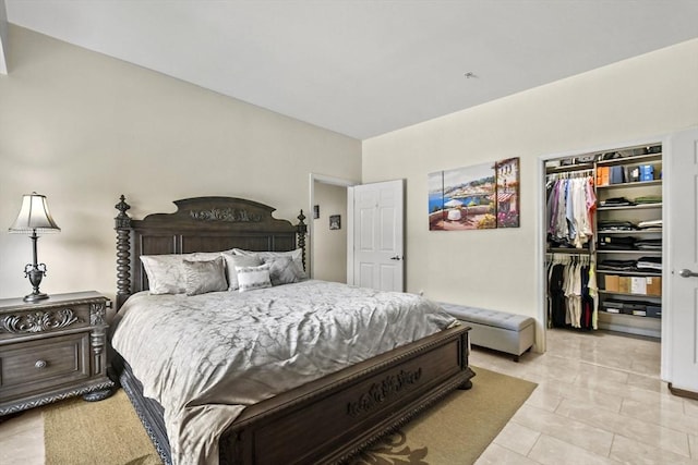 38 Village Rd Unit 309, Middleton, MA 01949 - bedroom with a walk in closet, a closet, and light tile patterned floors