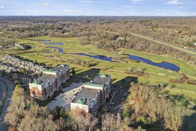38 Village Rd Unit 309, Middleton, MA 01949 - aerial view of property and surrounding area featuring a large body of water, a golf course, a forest, and apartment complex
