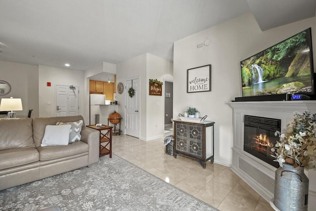 38 Village Rd Unit 309, Middleton, MA 01949 - living area featuring a glass covered fireplace, baseboards, recessed lighting, and light tile patterned floors