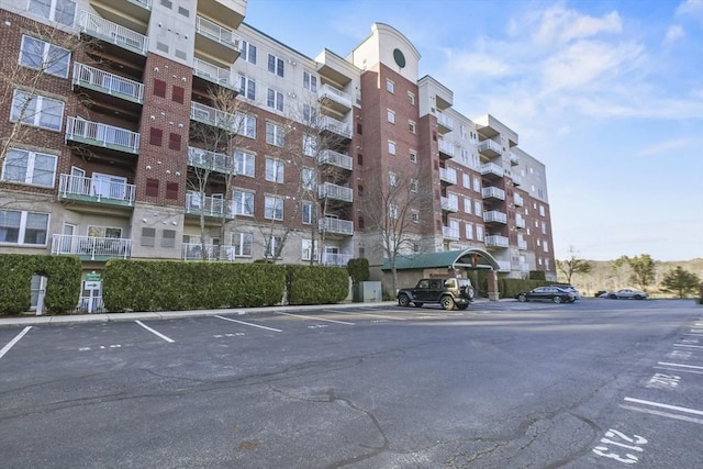 38 Village Rd Unit 309, Middleton, MA 01949 - view of apartment building / complex with uncovered parking