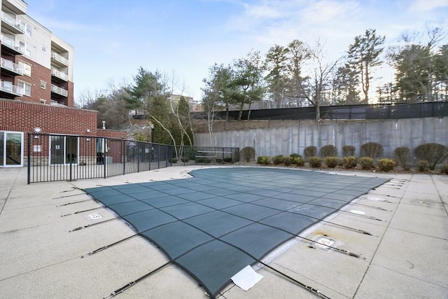 view of swimming pool featuring a patio area