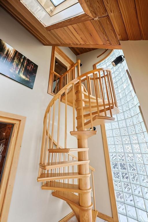 staircase featuring wood ceiling