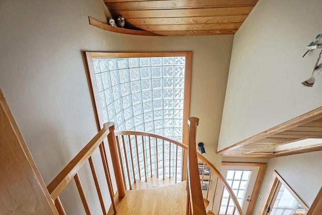 stairs featuring wood ceiling