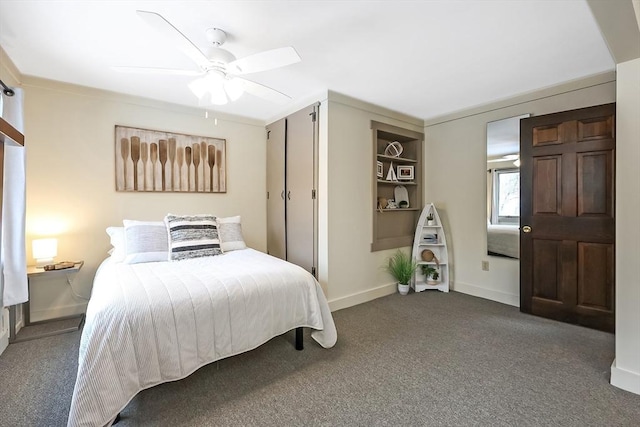 bedroom featuring ceiling fan, baseboards, and dark colored carpet