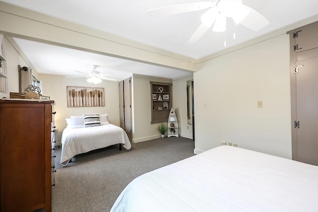 bedroom featuring baseboards, dark carpet, and a ceiling fan