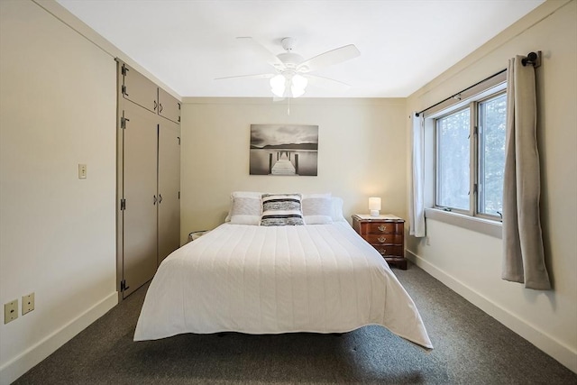 bedroom with ceiling fan, baseboards, and dark colored carpet