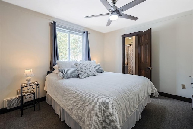 bedroom with dark colored carpet, ceiling fan, and baseboards