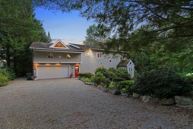 view of front of home with driveway and an attached garage