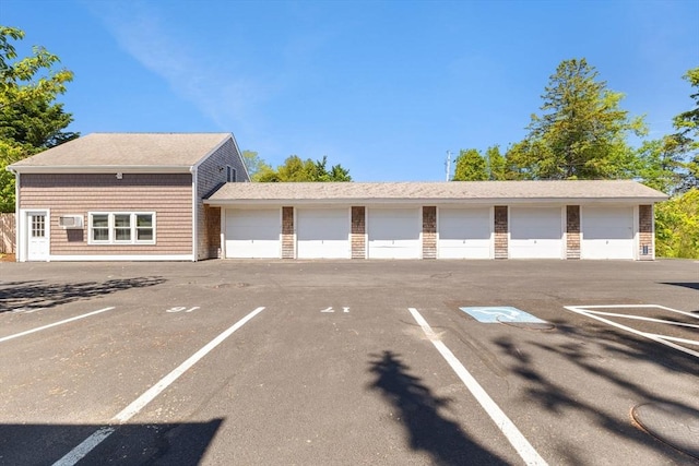 uncovered parking lot with community garages