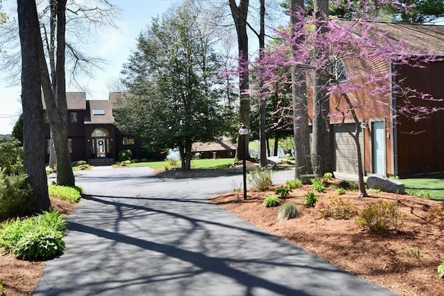 exterior space featuring aphalt driveway
