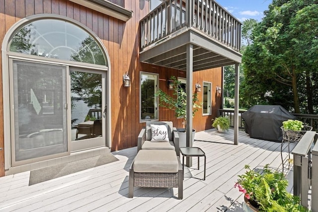 wooden deck featuring area for grilling