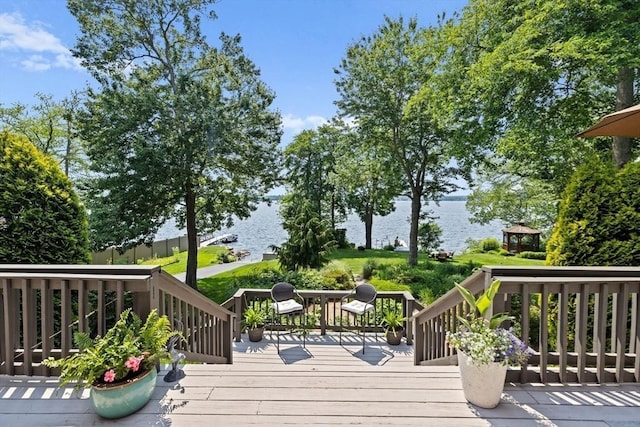 wooden deck with a water view