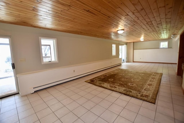 below grade area with plenty of natural light, wooden ceiling, light tile patterned floors, and a baseboard radiator