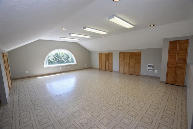bonus room with baseboards, recessed lighting, heating unit, and lofted ceiling