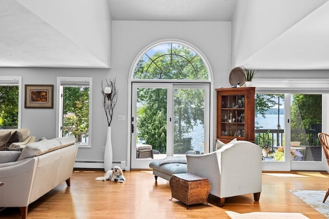 sitting room featuring baseboard heating and wood finished floors
