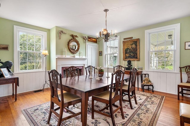 167 Bakerville, Dartmouth, MA 02748 - dining space with healthy amount of natural light, light wood-style flooring, wainscoting, and wooden walls