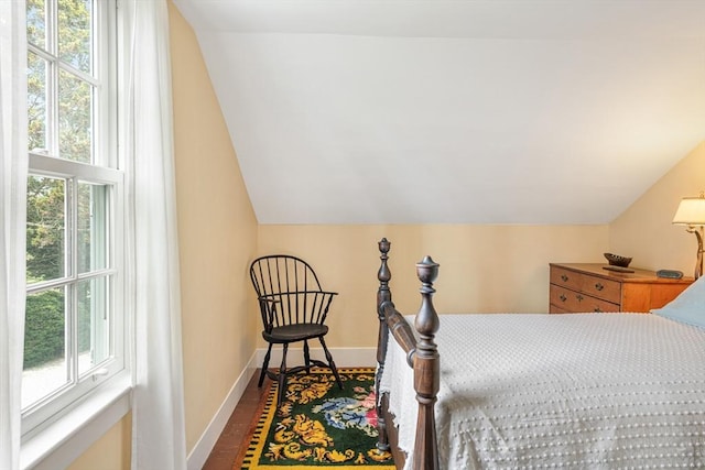 167 Bakerville, Dartmouth, MA 02748 - bedroom with multiple windows, lofted ceiling, baseboards, and dark wood-style floors