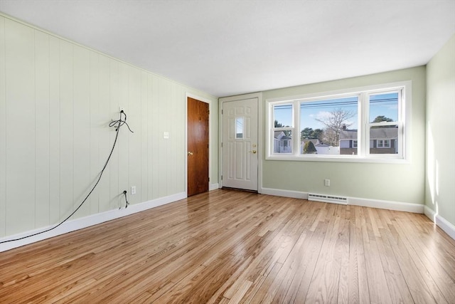 unfurnished room with light hardwood / wood-style flooring