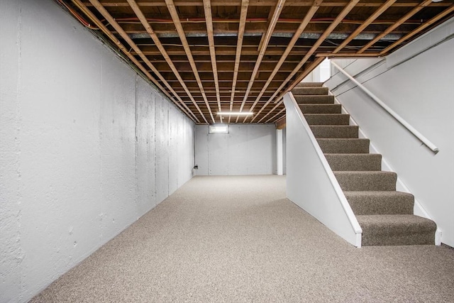 basement featuring carpet flooring