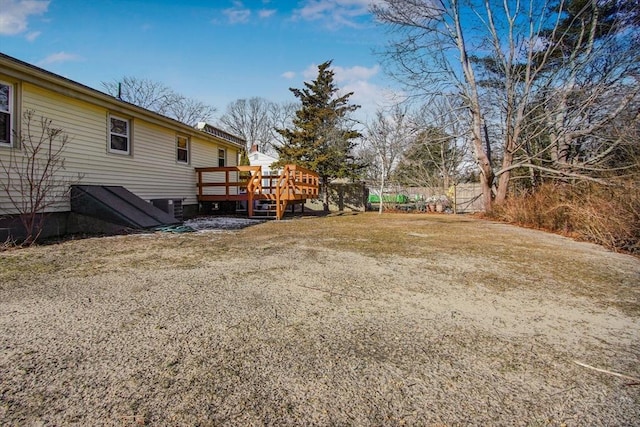 view of yard with a wooden deck and central AC