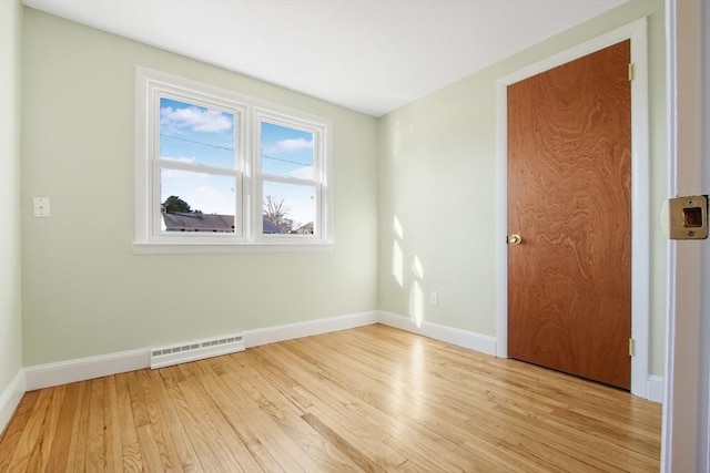 spare room featuring light hardwood / wood-style flooring