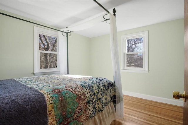 bedroom with light wood-type flooring