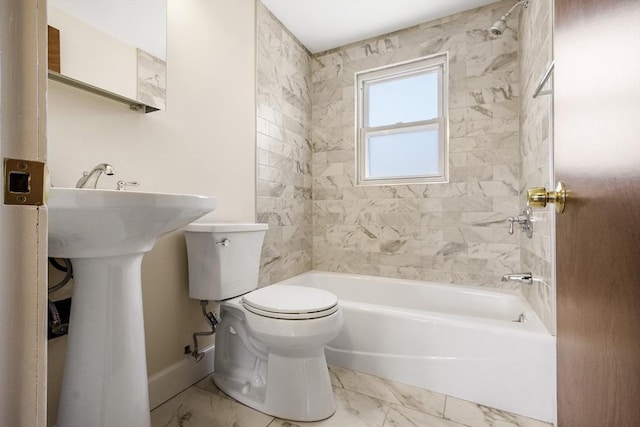 bathroom with toilet and tiled shower / bath combo