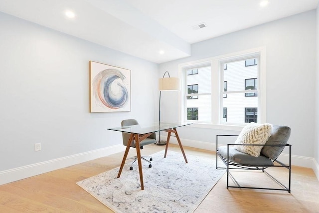 home office with light wood-type flooring