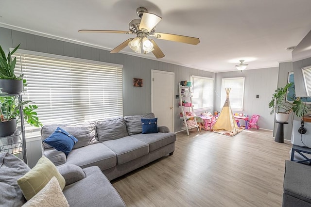 1001 Belleville Ave, New Bedford, MA 02745 - living area featuring light wood-style floors, a ceiling fan, and crown molding