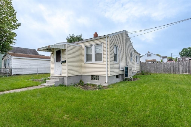 1001 Belleville Ave, New Bedford, MA 02745 - view of front of property featuring a chimney, central AC, and entry steps