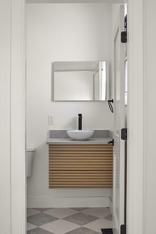 bathroom with vanity and toilet