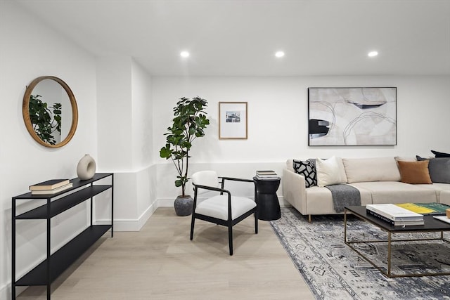 living room with light hardwood / wood-style flooring